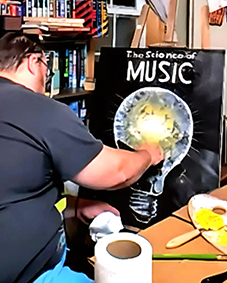 Allen Van Wert hand painting the oil cover art